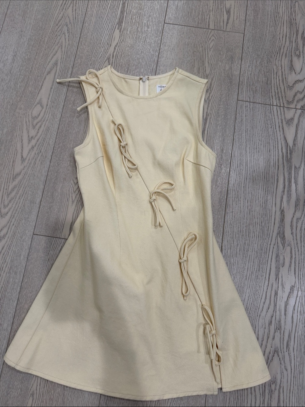 Sleeveless Cream Mini Dress with Decorative Tie Details